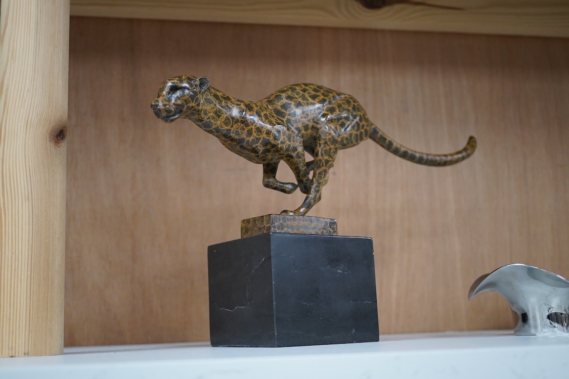 A patinated bronze cheetah bearing J.B. Depose foundry stamp, on slate plinth, 19cm high